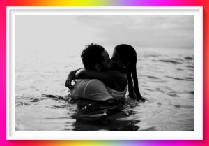 couple kissing in river for a taste of premium