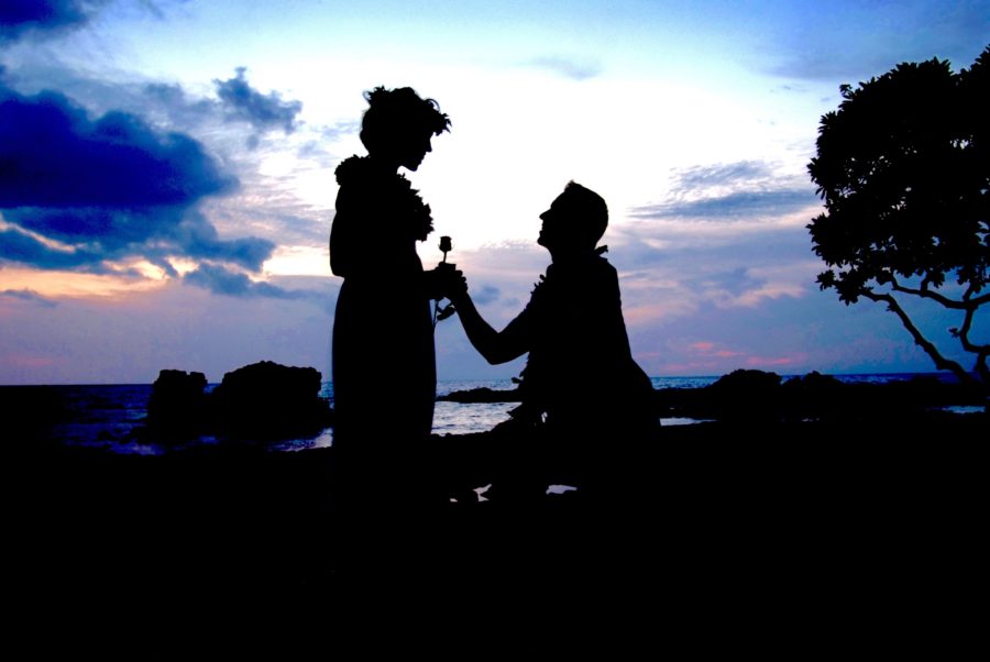 sihouette couple backlit clouds proposal