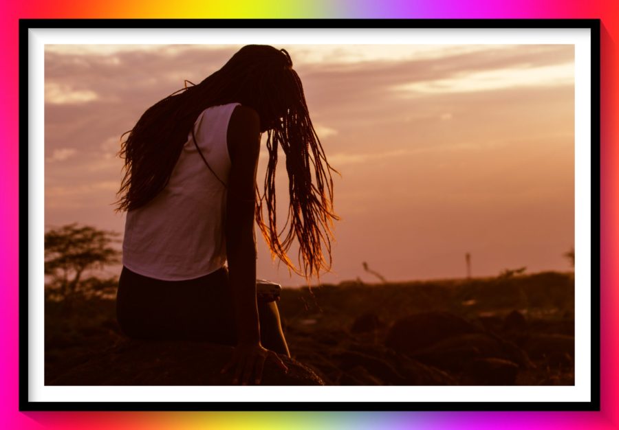 the unbreakable story a sad girl sitting on a boulder