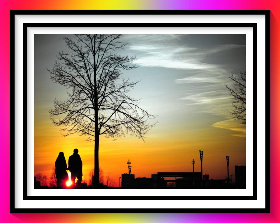 Silhouetted couple in front of a tree for Unbreakable Final Episode