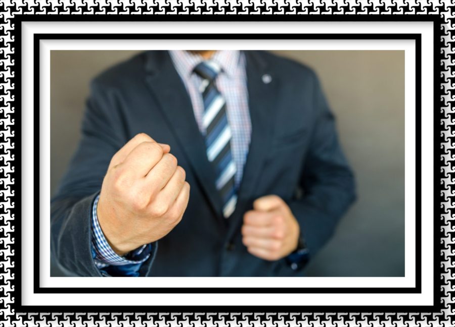 Man in suit with a fisted hand image for The Blowman Husband